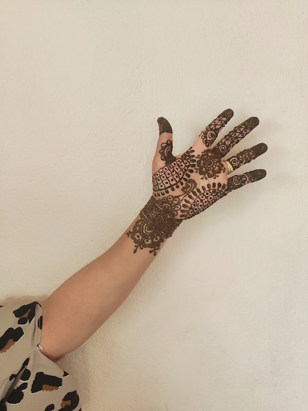 Intricate mehndi henna design on hands